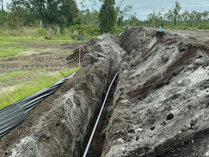 Utility trench with conduits running down the center